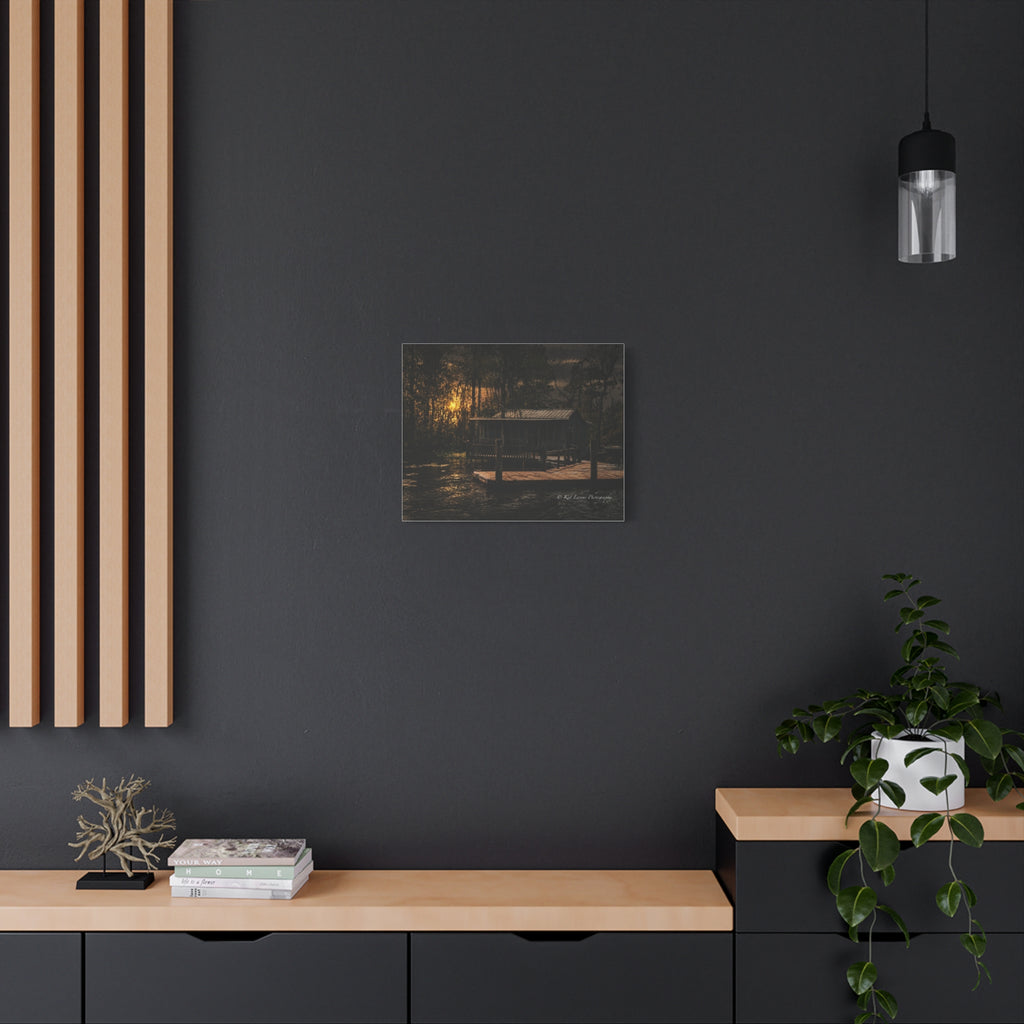 Last Light on the Bayou canvas print displayed in a dark moody interior.