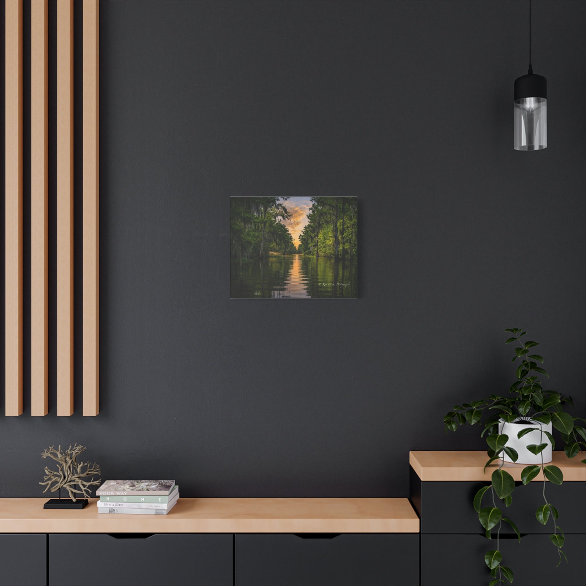 Moody Louisiana bayou sunset canvas wall art displayed in a dark interior.