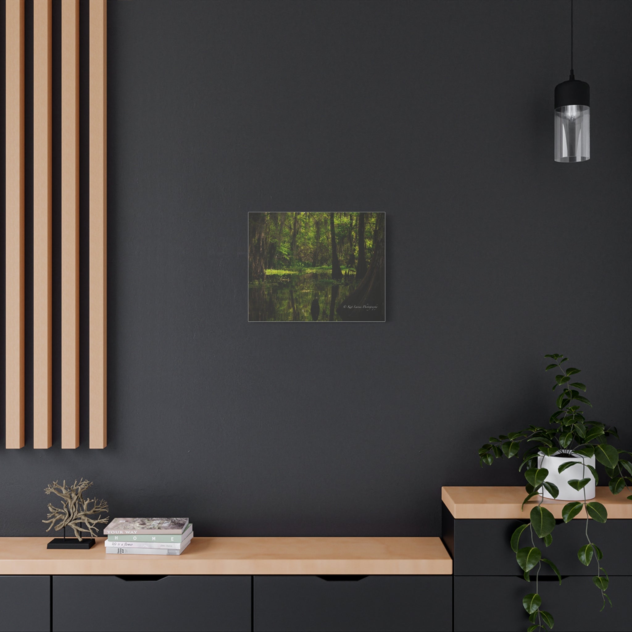 Cathedral of Moss Louisiana cypress swamp canvas displayed as moody green wall art in a dark modern interior.