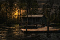 Last Light on the Bayou photograph of a rustic Louisiana waterfront cabin glowing in golden sunset light.